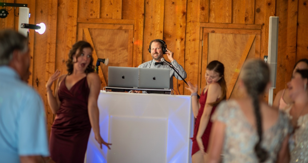 DJ Nathan from Firefly Entertainment performing at a destination wedding